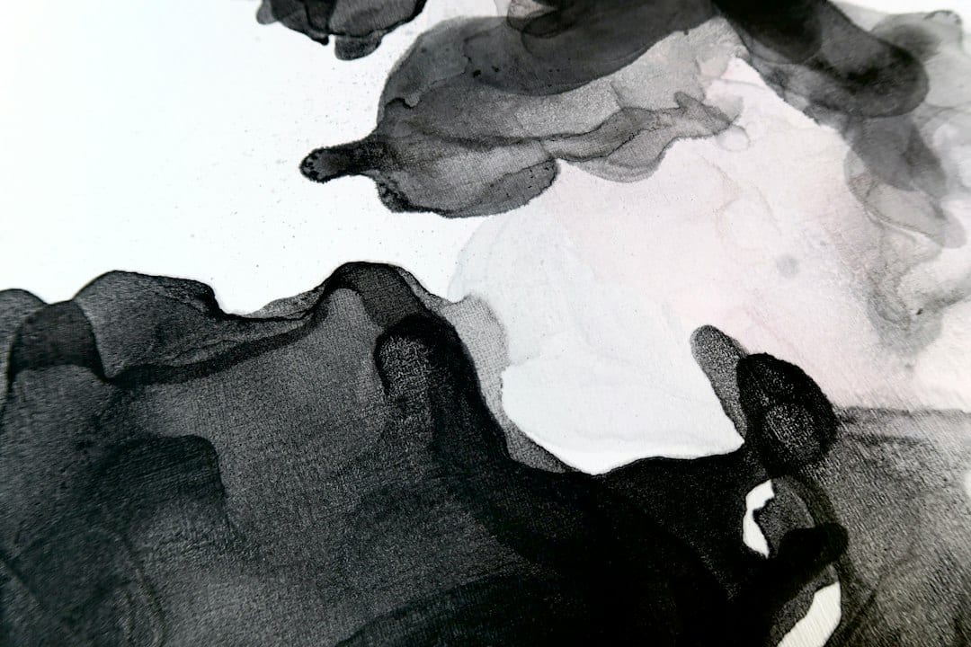Abstract ink flowing on paper texture