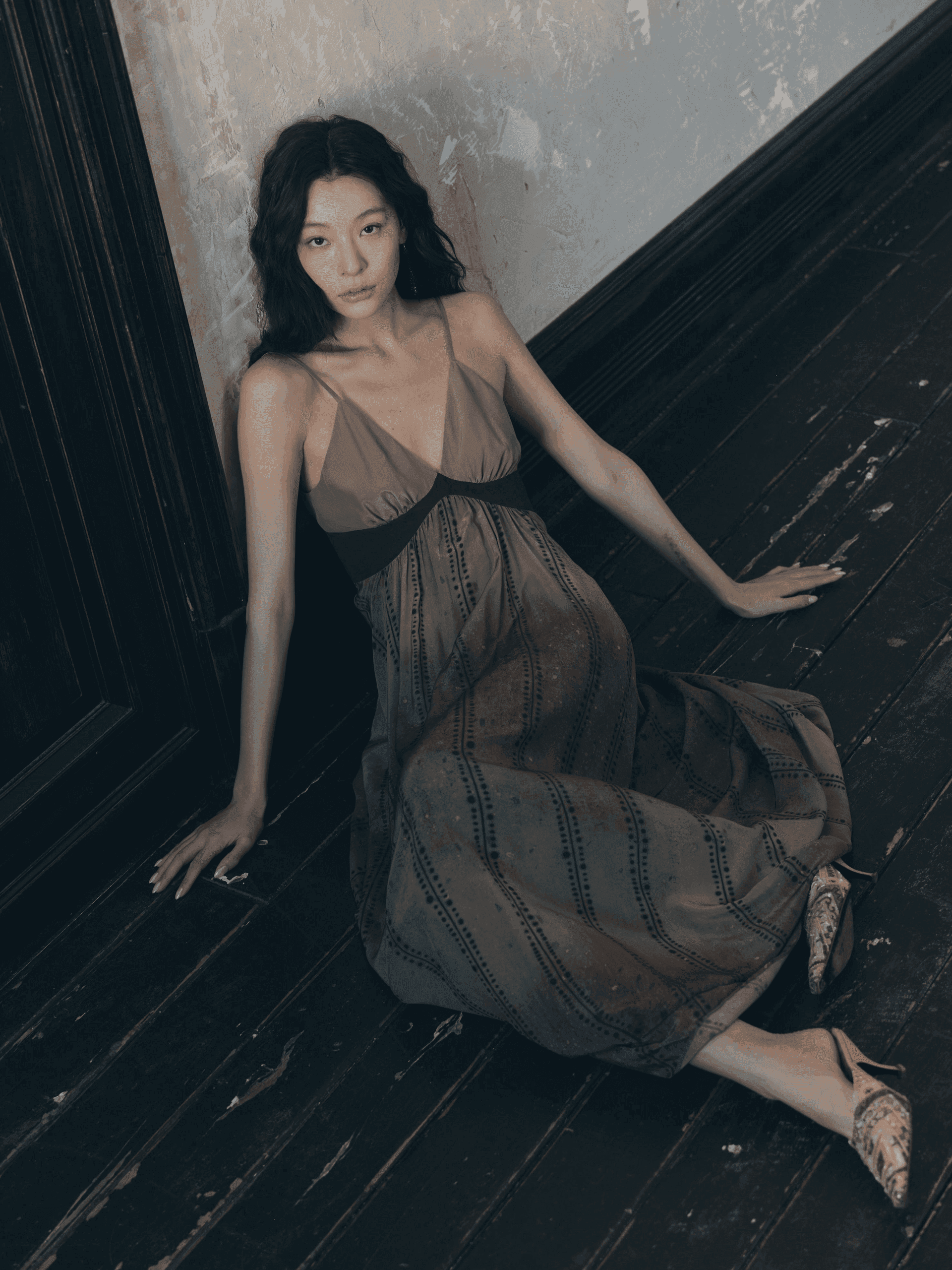 Stripe Fission collection look — flowing draped pleats intersecting with sharp linear stripes