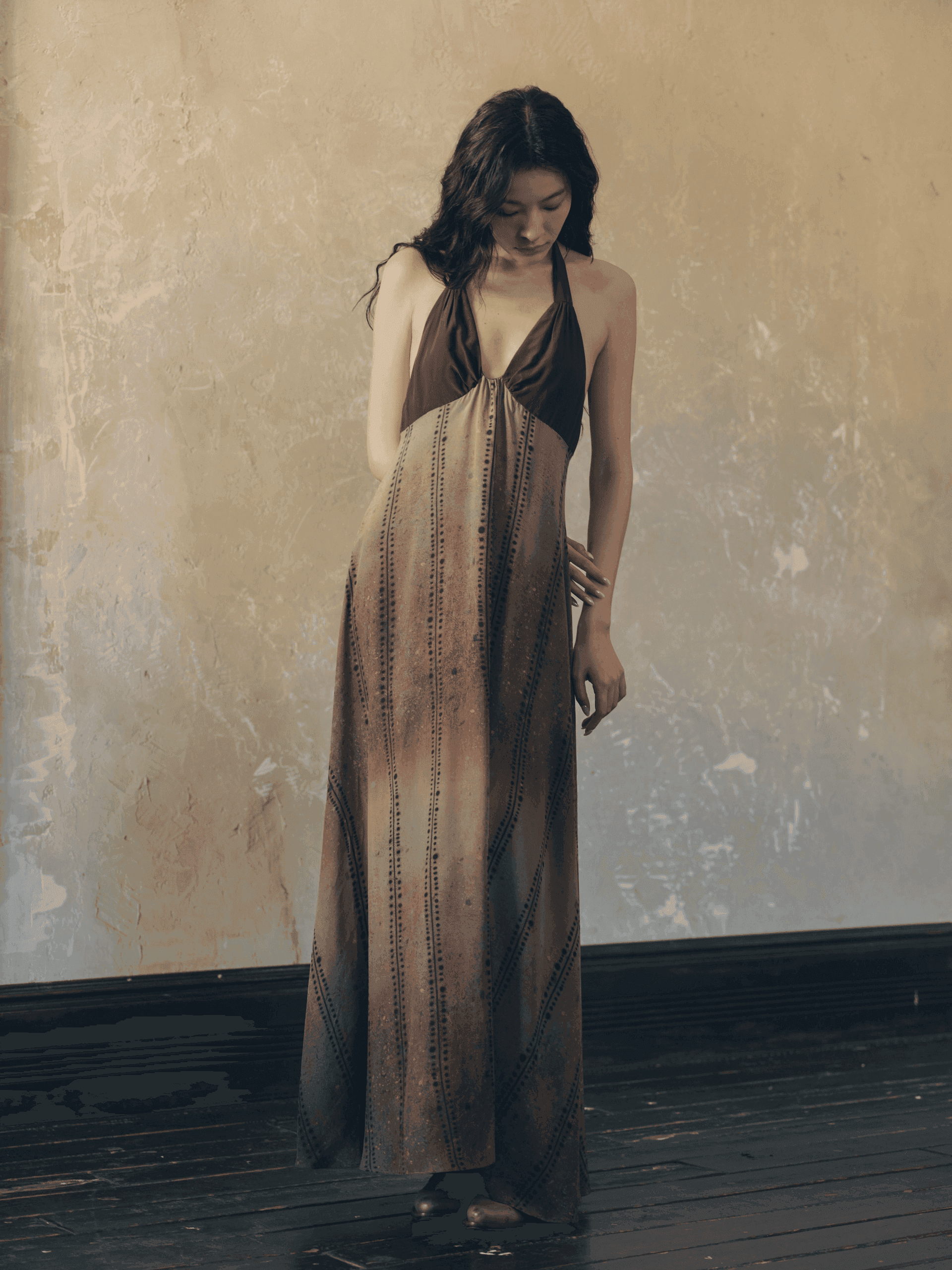 Stripe Fission collection look — confident feminine silhouette in dynamic stripe composition